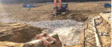 Excavator and workers preparing a deep foundation trench at the Blandings estate in Wentworth during bulk excavation
