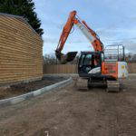 exterior barn with digger