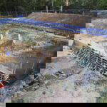 Temporary concrete works, sealed the running sand from washing into the excavation.