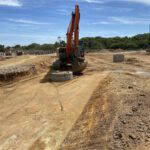 Preformed manholes going into road 1 excavated with 3D machine control