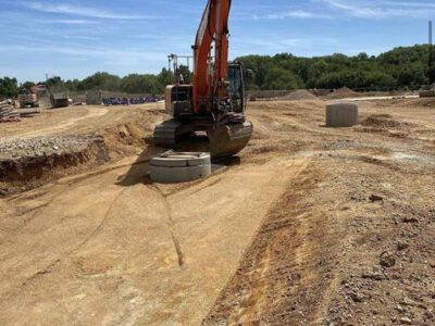 Preformed manholes going into road 1 excavated with 3D machine control