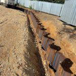 Installing permanent sheet piling with silent vibrating method