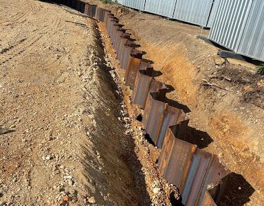Installing permanent sheet piling with silent vibrating method